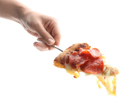 Woman with piece of tasty pepperoni pizza on white background, closeupの写真素材