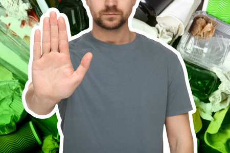 Environmental pollution. Man showing stop gesture, closeup. Garbage on backgroundの写真素材