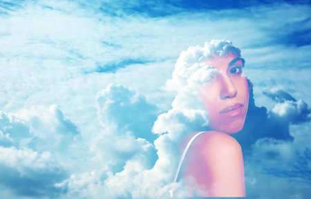 Beautiful woman and picturesque sky with clouds, double exposureの写真素材