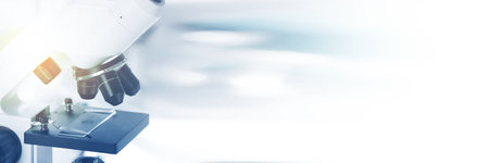 Microscope on blurred background, closeup. Banner design with space for text