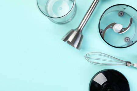 Hand blender kit on light blue background, flat lay. Space for textの写真素材