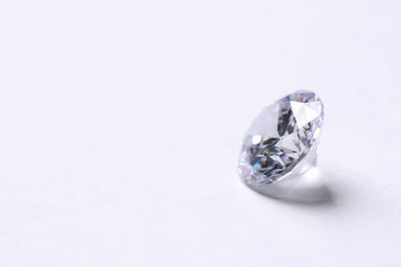 One beautiful shiny diamond on white background, closeup. Space for textの写真素材