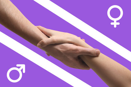 Gender equality concept. Man and woman holding hands, male and female signs on purple backgroundの写真素材