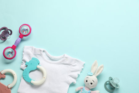 Baby accessories on light blue background, flat lay. Space for textの写真素材