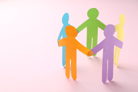 Equality concept. Paper human figures on pink background, closeup. Space for textの写真素材