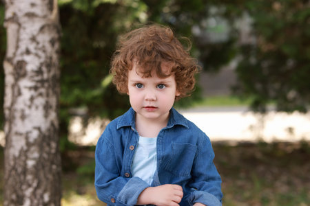 Portrait of little boy outdoors. Cute childの写真素材