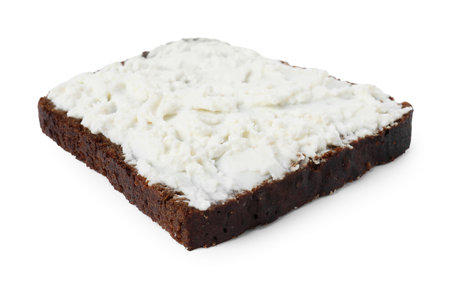 Delicious fresh ricotta (cream cheese) on piece of bread isolated on white