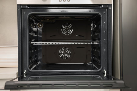 Open electric oven in kitchen. Cooking applianceの写真素材