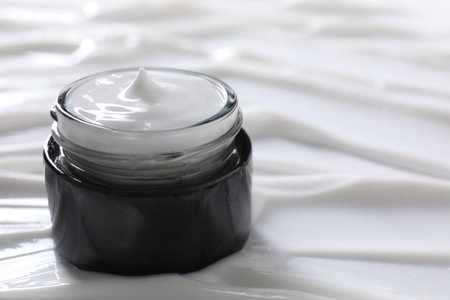 Jar with face cream, closeup. Space for textの写真素材