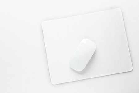 Wireless mouse and mousepad on white background, top viewの写真素材