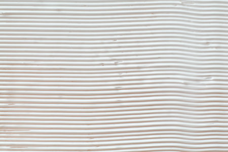 Smears of cosmetic product as background, top view