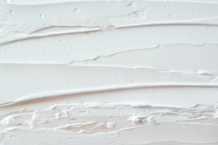 Smears of cosmetic product as background, top view