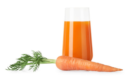 Healthy carrot juice in glass and fresh vegetable isolated on whiteの写真素材