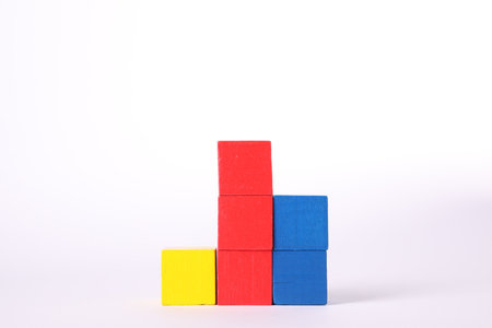 Many colorful wooden cubes isolated on whiteの写真素材