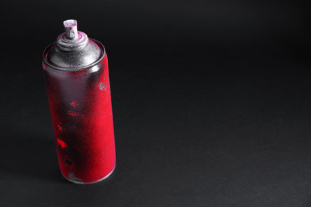 One spray paint can on dark background, space for textの写真素材