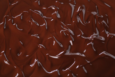 Delicious melted chocolate as background, top viewの写真素材
