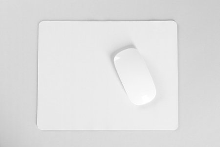 Wireless mouse and mousepad on white background, top viewの写真素材