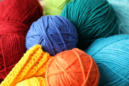 Many different yarns and knitting sample as background, closeupの写真素材