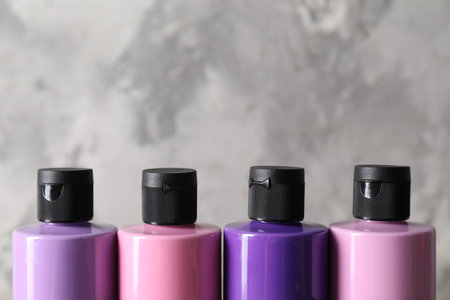 Acrylic paints of different colors against blurred background, closeupの写真素材