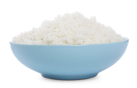 Tasty cooked rice in bowl isolated on whiteの写真素材