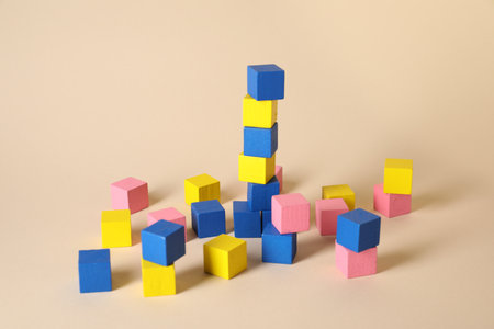 Many blank colorful cubes on beige background