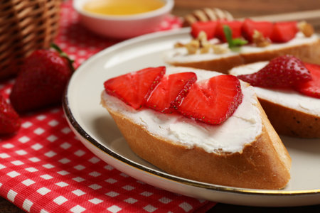 Delicious bruschetta with ricotta cheese and strawberries on table, closeupの写真素材