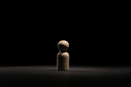 Loneliness concept. Human figure in darkness aloneの写真素材