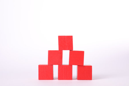 Many red wooden cubes isolated on whiteの写真素材