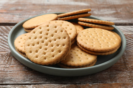 Tasty sandwich cookies on wooden table, closeupの写真素材