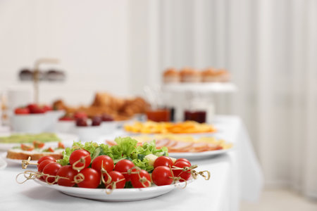 Different meals served on white table indoors, closeup. Buffet menuの写真素材