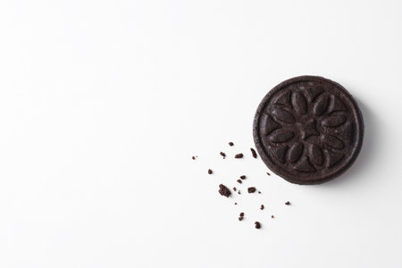 One tasty sandwich cookie on white background, top view. Space for text
