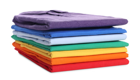 Stack of clean colorful t-shirts isolated on whiteの写真素材