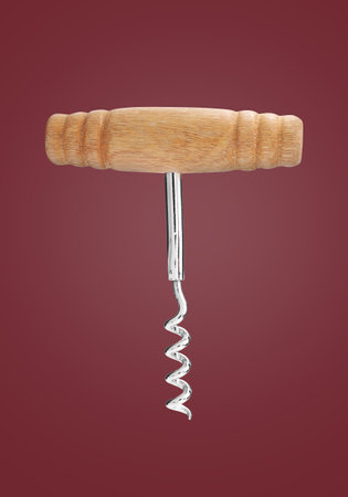 Corkscrew with wooden handle on red backgroundの写真素材