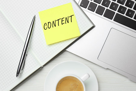 Note with word Content written in notebook on table. Workplace, top viewの写真素材