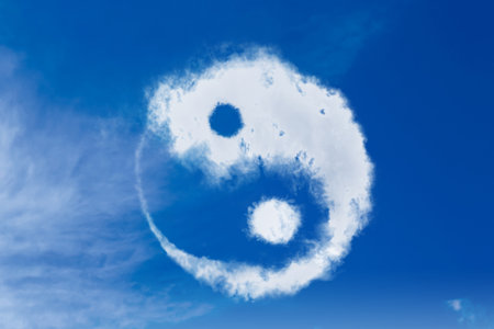 Yin and yang symbol made of clouds in skyの写真素材