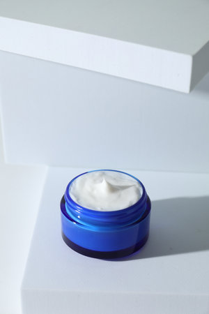 Stylish presentation of facial cream on white backgroundの写真素材