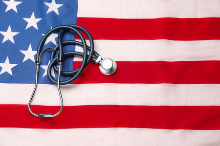 Stethoscope on USA flag, top view. Health care conceptの写真素材