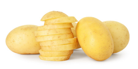 Fresh whole and cut potatoes isolated on whiteの写真素材