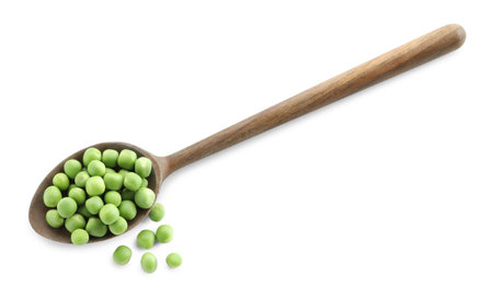 Spoon with fresh green peas isolated on white, top viewの写真素材