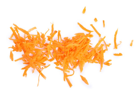 Pile of fresh gratified carrot isolated on white, top viewの写真素材