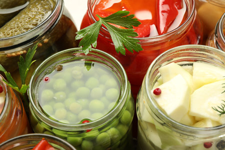 Different pickled products in jars, closeup viewの写真素材