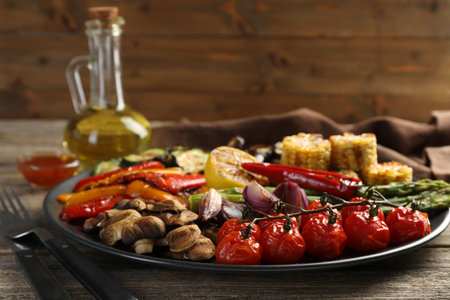 Delicious grilled vegetables served on wooden table, closeupの写真素材