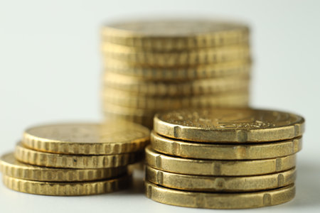 Stacked euro coins on white background, closeupの写真素材