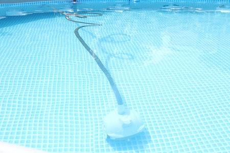 One robotic cleaner in swimming pool outdoors