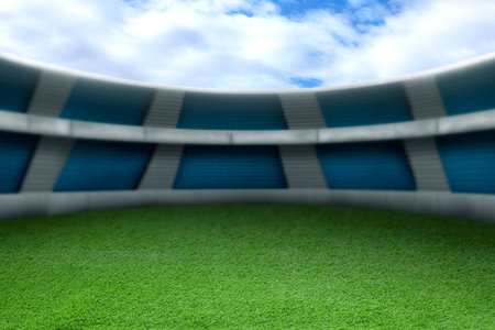 Football stadium with green grass and seat under skyの写真素材