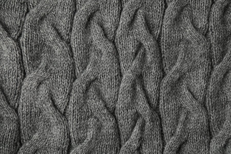 Texture of gray knitted fabric as background, top view