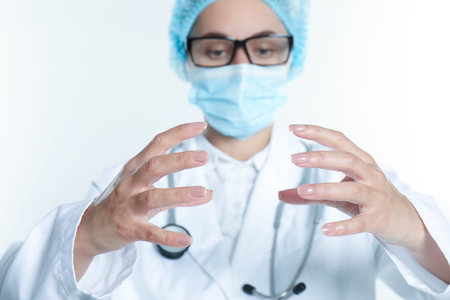 Doctor holding something on white background, selective focusの写真素材