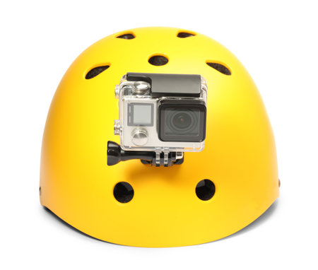 Modern action camera on helmet against white backgroundの写真素材