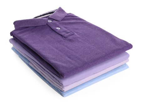 Stack of clean colorful t-shirts isolated on whiteの写真素材