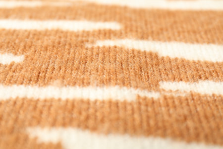 Texture of bright knitted fabric with pattern as background, closeup